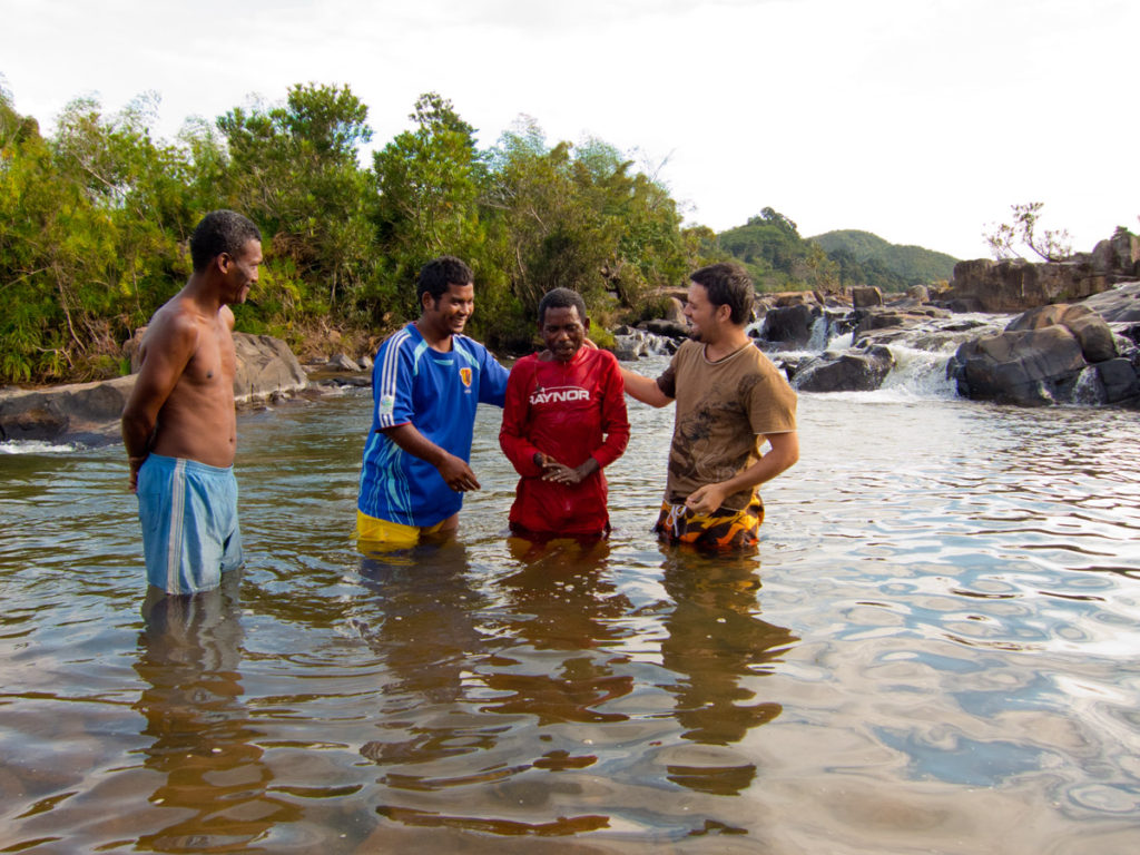 Baptizing the first new believer in Antenina - new life!