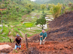 Working together to terrace a new ricefield with one of the guys in one of the Bible study groups.