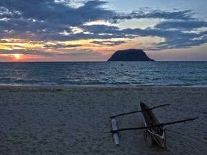 One of the outrigger canoes used for fishing on Nosy Mitsio. The scene is looking onto another very small island in the bay of Nosy Mitsio.