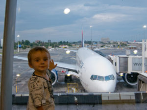 Matimu at the airport, waiting to fly on a trip from South Africa to the US. Matimu LOVES airplanes!