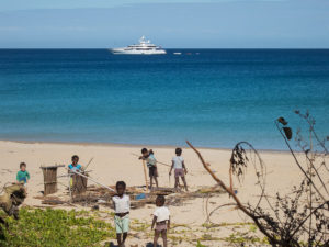 Some sort of large cruise ship that passed by Nosy Mitsio several times, while the kids (including Matimu) were using leftover construction materials to build their own houses on the beach.