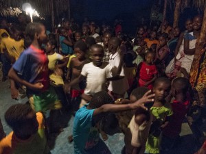 Some of the kids having a great time dancing to the lights and music powered by a visitor's generator during the first night of the ceremony.