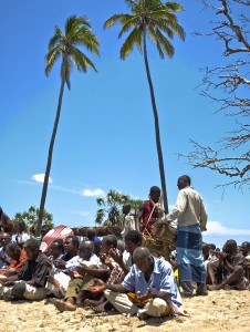 Men lifting their hands in worship to their ancestors to the rhythm of the traditional drums.