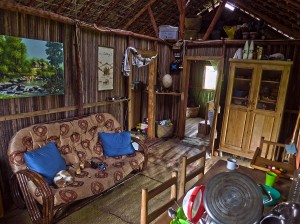 The main room of our home on Nosy Mitsio, with our surviving cat asleep on the couch.