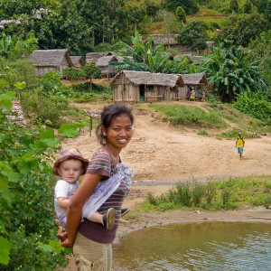 Madagascar 5 photos - our friend Njara helping carry Matimu on the long hike out to Antenina Village