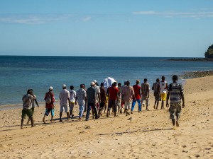 A funeral on Nosy Mitsio - the young men carrying the body across the island to the burial ground.