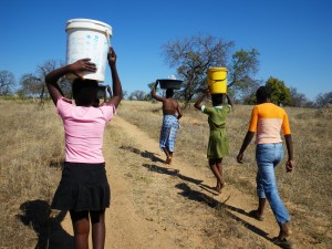 Girls carrying water