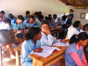 Lora teaching an English lesson in a classroom in Madagascar