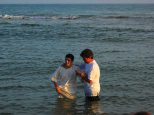 A baptism for a new believer, in the Mediterranean sea near Rome.