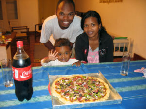 Our friends enjoying pizza at our house during her birthday. At least we've got the chance to feed them well!