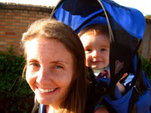 Lora carrying Matimu in a hiking backpack before going hiking one day.