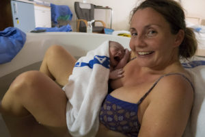 Lora just minutes after David was born, with a great big smile on her face. What a strong woman!