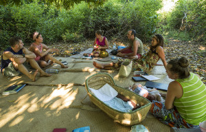 Our team meeting under a mango tree each week while waiting for our meeting hut to be rebuilt.