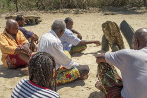 Many of the local village headmen offering a sacrifice at the sacred stones in our village.