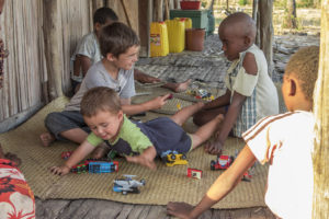 The kids in our village playing with Matimu and David on our porch.