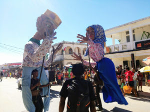 Giant Antakarana "marionettes" leading the parade for Independence Day along the main street of Ambilobe.